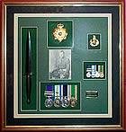 Framed medal display including dagger 